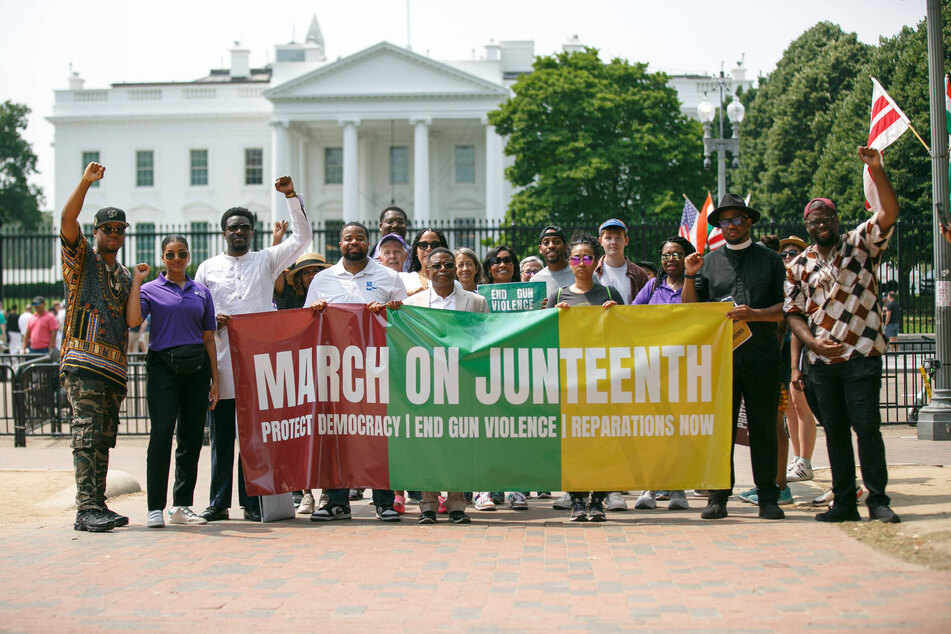 Demonstrators participate in a Juneteenth march for reparations, voting rights, and an end to gun violence on June 19, 2023.