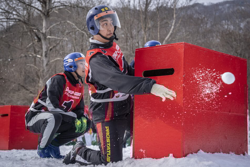 Players compete during the Showa-shinzan International Yukigassen snowball fight competition in Sobetsu, Hokkaido prefecture, on February 21, 2026.