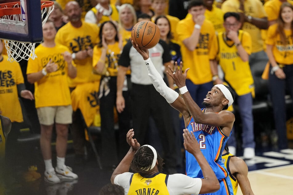 Oklahoma City Thunder guard Shai Gilgeous-Alexander drives to the basket against Indiana Pacers center Myles Turner during the first half of Game 6 of the 2025 NBA Finals.