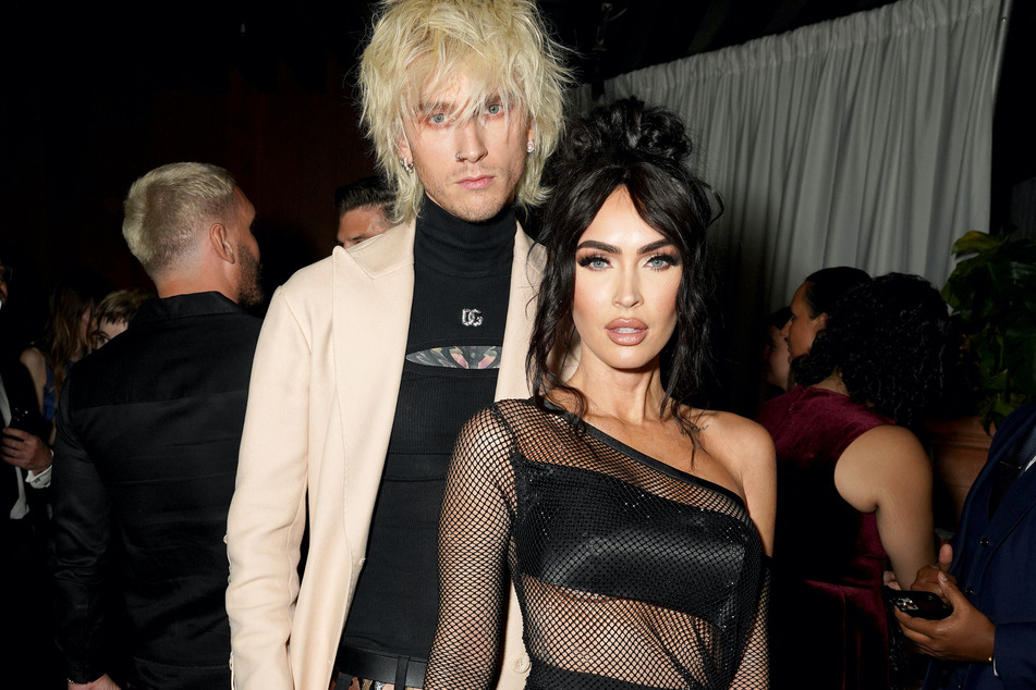 Megan Fox (r.) and Machine Gun Kelly are allegedly still together and working on their romance amid calling off their engagement.