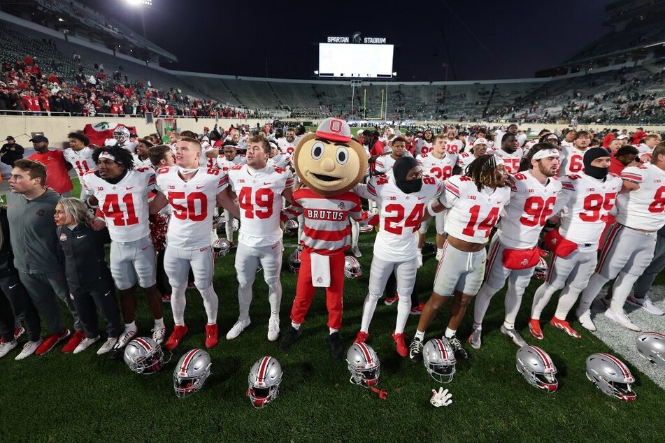 The Ohio State Buckeyes celebrated a 49-20 win over the Michigan State Spartans at Spartan Stadium.