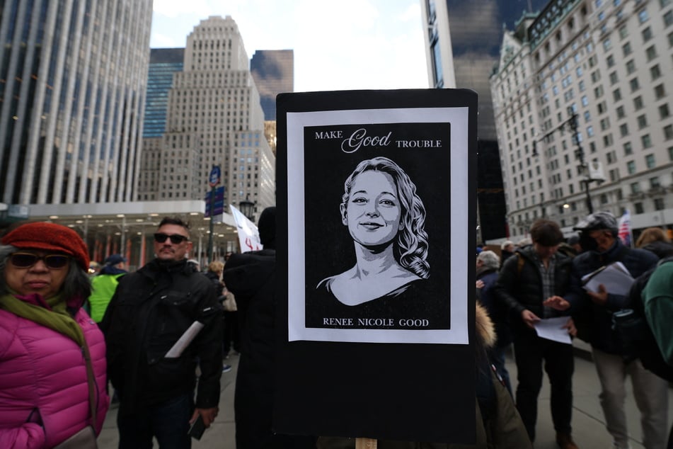 A person holds a poster of Renee Nicole Good, who was shot and killed by an ICE agent in Minneapolis, Minnesota, during a protest in New York City on January 11, 2026.