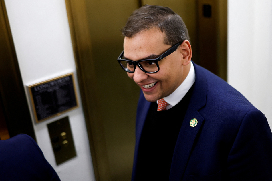 US Representative George Santos speaks to reporters as he departs his Washington DC office on January 24, 2023.