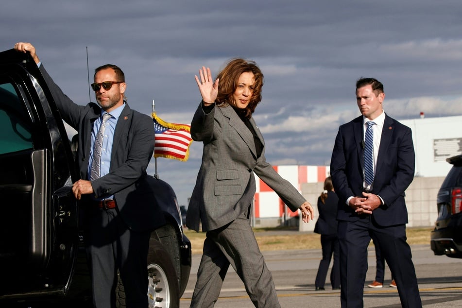 Former Vice President Kamala Harris (c.) arrives to board Air Force Two as she departs LaGuardia Airport in Queens, New York, September 22, 2024.