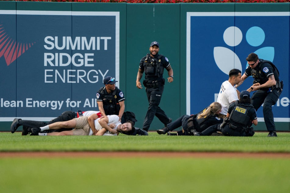 Climate activists play hardball during Congressional Baseball Game marked by arrests