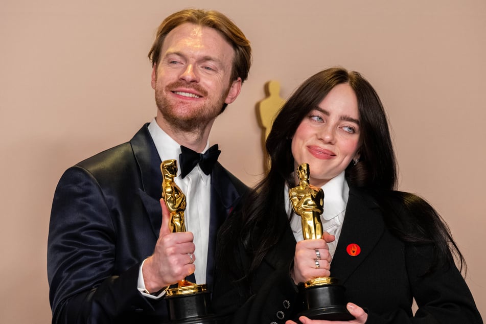 Billie Eilish (r.) is learning the ropes of producing music on her own with the help of her older brother, Finneas.