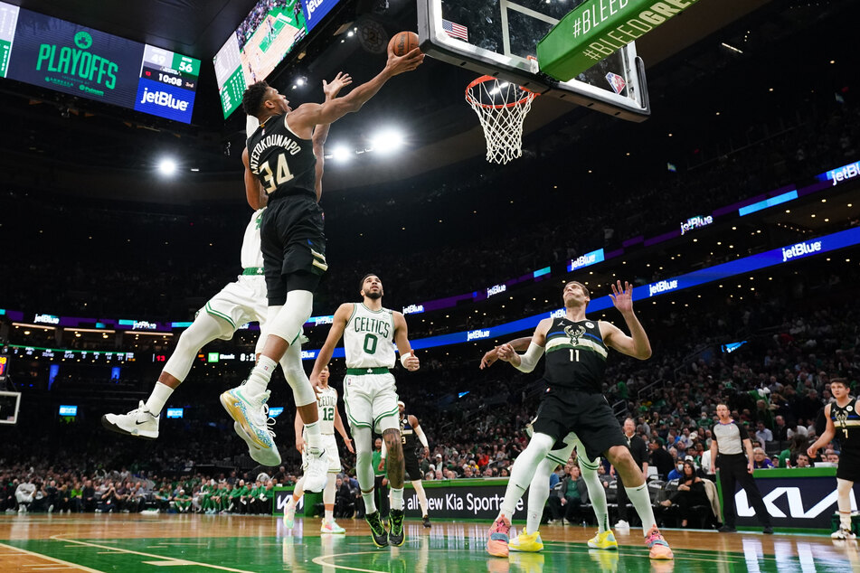 Giannis Antetokounmpo rises to score against the Celtics.