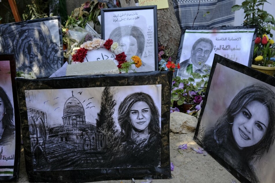 Drawings at an art exhibit honor slain Palestinian-American Al-Jazeera journalist Shireen Abu Akleh at the spot where she was killed while covering an Israeli army raid in Jenin in the occupied West Bank.