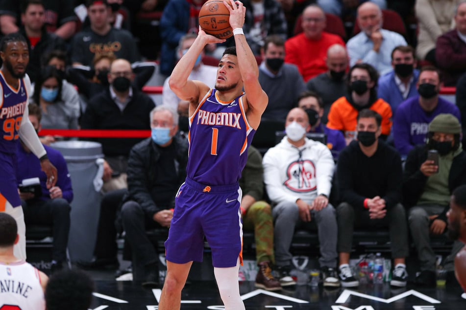 The Suns' Devin Booker scoring one of his five three-pointers against the Bulls.