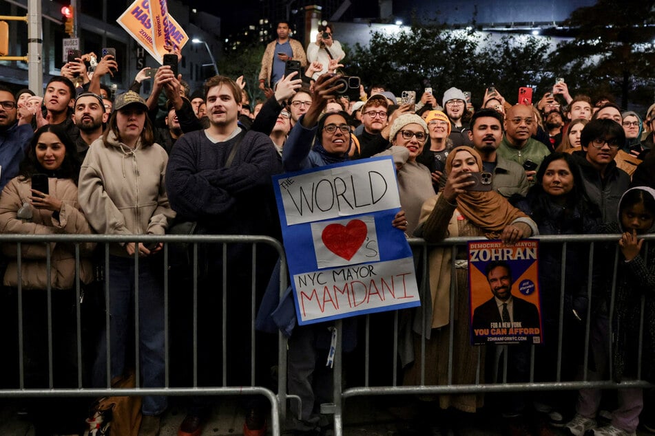 Supporters celebrate after Zohran Mamdani won the 2025 New York City mayoral race, outside the venue of an election night watch party in Brooklyn on November 4, 2025.