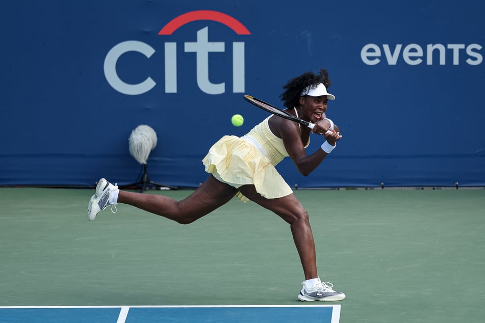Venus Williams returns a shot during a women's doubles match on day 1 of the Mubadala Citi DC Open 2025.
