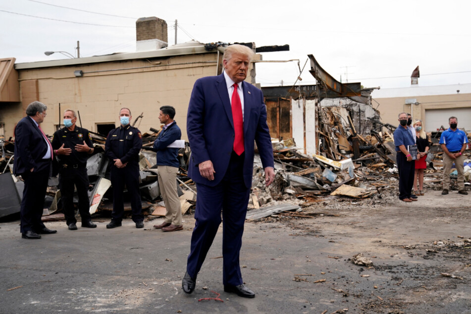 Donald Trump surveying damage from the protests that followed the shooting of 29-year-old African-American Jacob Blake.