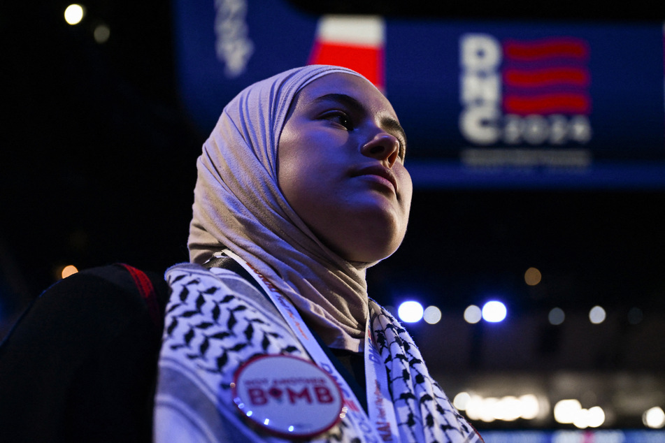 Uncommitted delegate Meryem Maameri of Minnesota wears a keffiyeh as she attends Day 3 of the Democratic National Convention at the United Center in Chicago, Illinois.