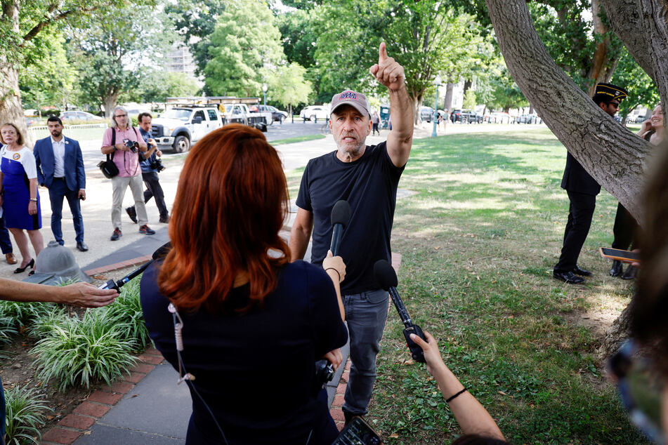 Jon Stewart speaking in front of the US Capitol building after news broke that the PACT Act failed to pass.