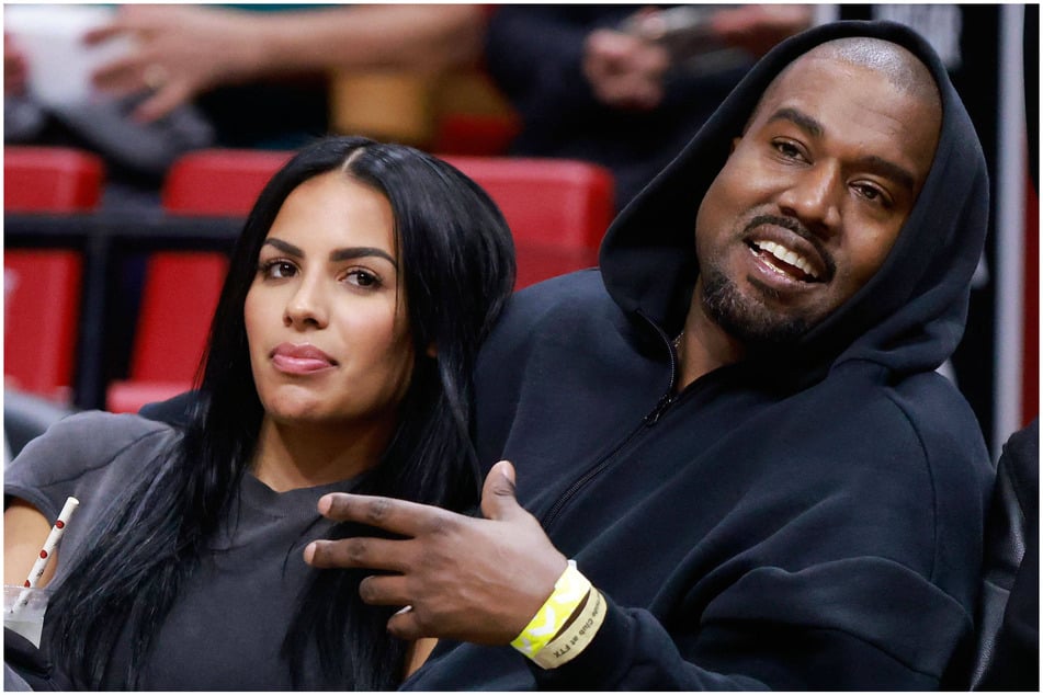 Kanye West with internet dubbed "Kim clone" No. 1 - model Chaney Jones - at an NBA game in March 2022.