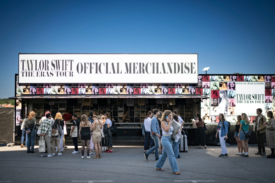 Fans buy merchandise outside the Friends arena in Stockholm, Sweden, before Taylor Swift's Eras Tour show.