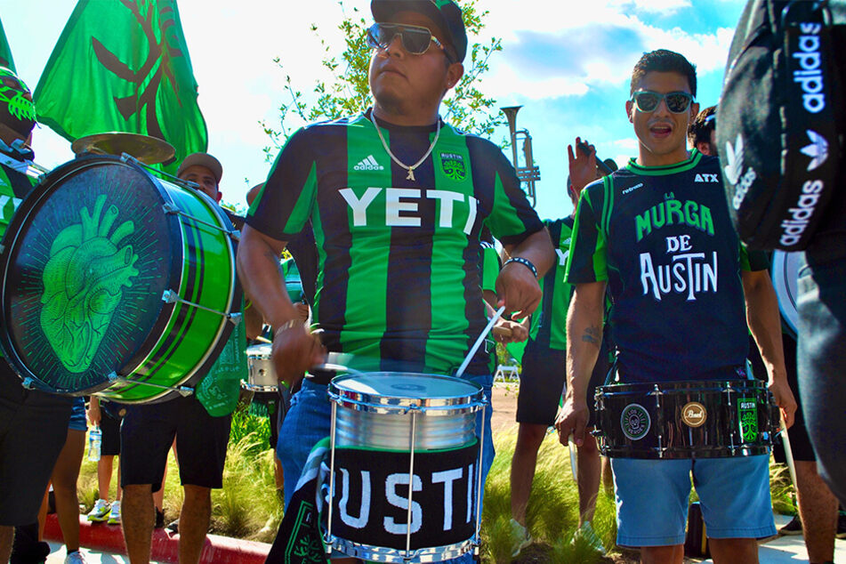 La Murga de Austin performs outside Q2 Stadium as they await the arrival of Austin FC players.