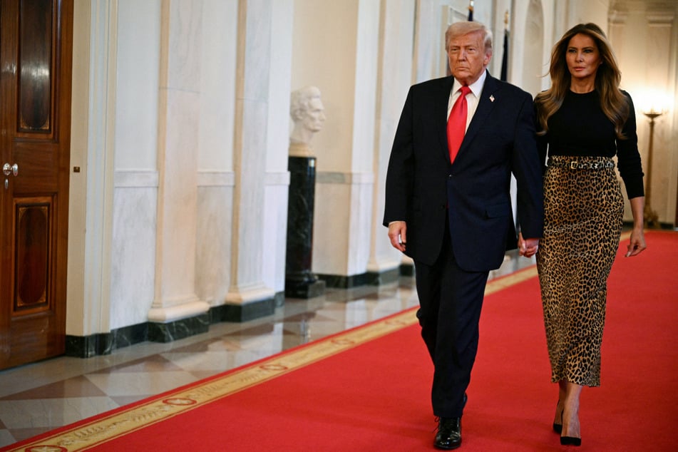 President Donald Trump (l) revealed that he had no idea that his wife Melania Trump (r) was going to give a surprise statement on her association with Jeffrey Epstein.