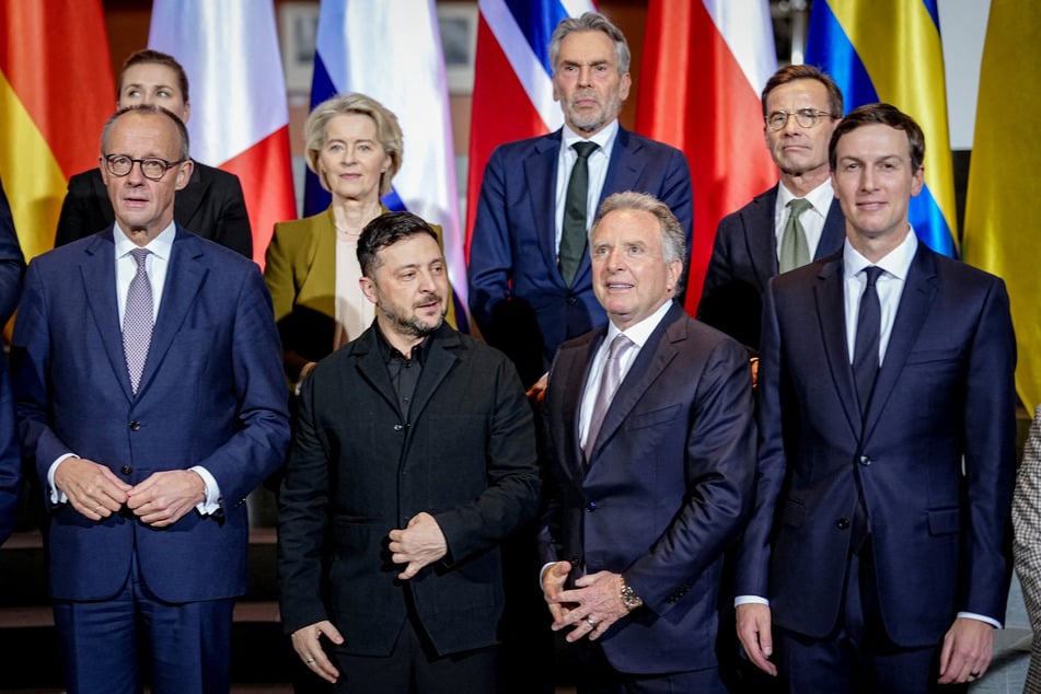 Ukraine's President Volodymyr Zelensky, US Special Envoy Steve Witkoff, US President Donald Trump's son-in-law Jared Kushner, German Chancellor Friedrich Merz, and European Commission President Ursula von der Leyen line up for a photo at the Chancellery in Berlin, Germany, on December 15, 2025.
