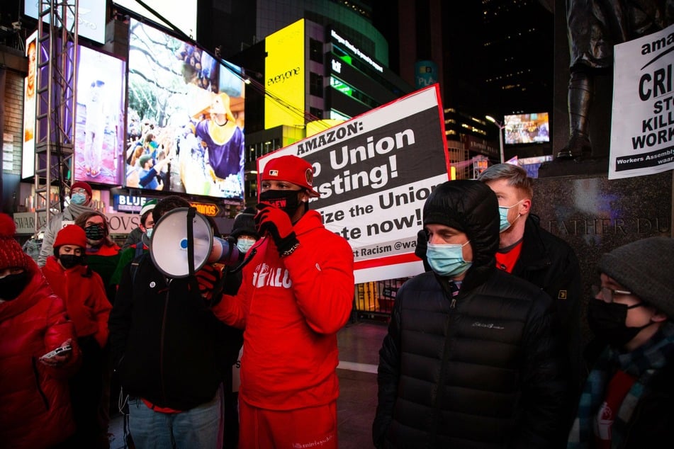 Christian Smalls (c.) and other Amazon Labor Union organizers gather at a rally in New York City's Times Square on December 22.