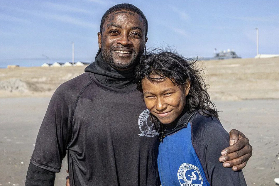 Lou Harris hits the beach with his daughter, who is also learning to surf.