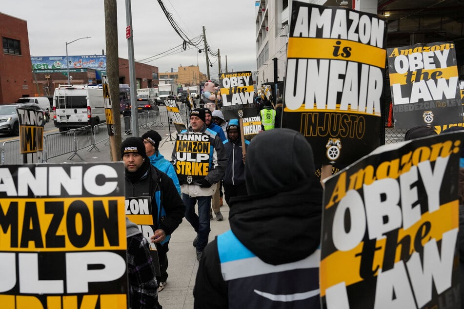 Amazon workers and supporters take part in a strike organized by the Teamsters union at the company's facility in the Queens borough of New York City.