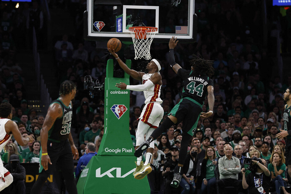 Miami Heat forward Jimmy Butler shoots ahead of Boston Celtics center Robert Williams III during the second half of Game 6.