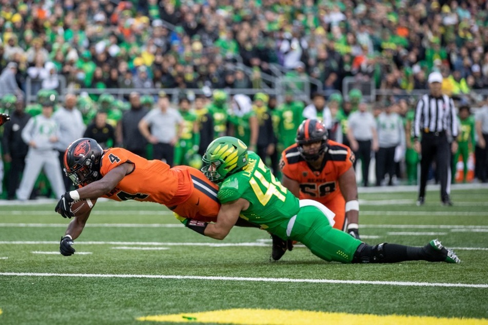 Jackson LaDuke of the Oregon Ducks makes a tackle against Oregon State at Autzen Stadium.