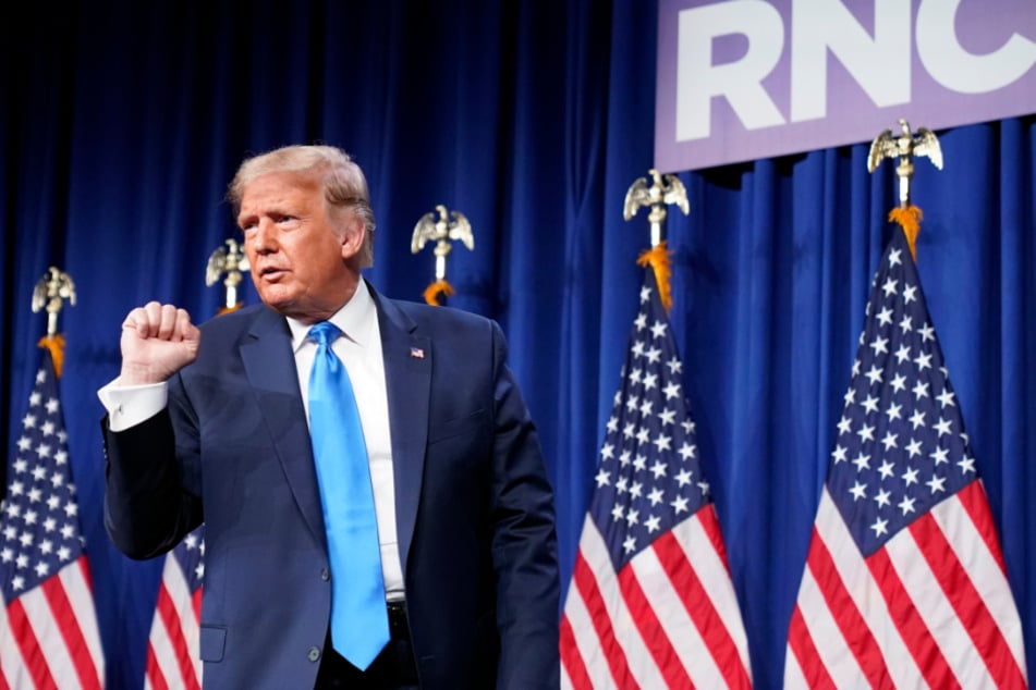 Charlotte: Donald Trump clenches his fist after a surprise appearance at day one of the Republican National Conference.