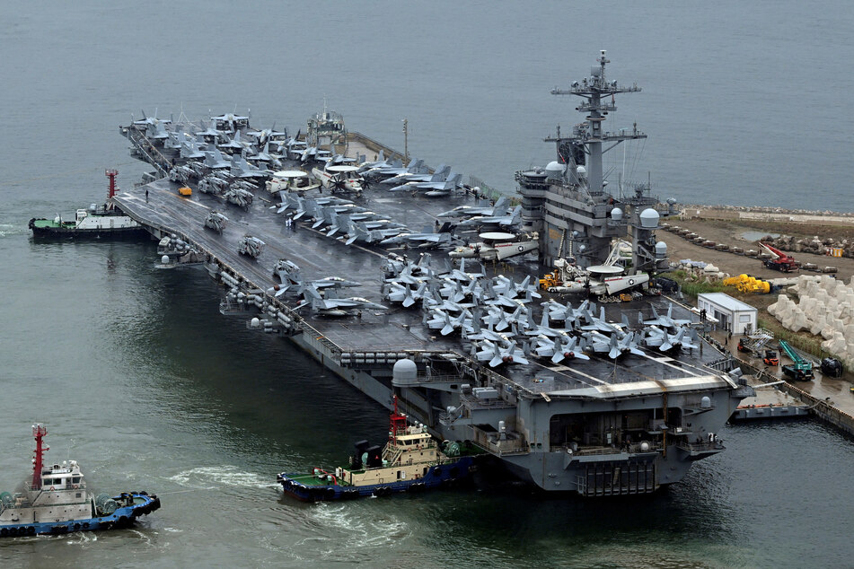 A nuclear-powered US aircraft carrier, the Theodore Roosevelt, arrives in the South Korean port city of Busan to take part in joint military exercises with the host nation and Japan.