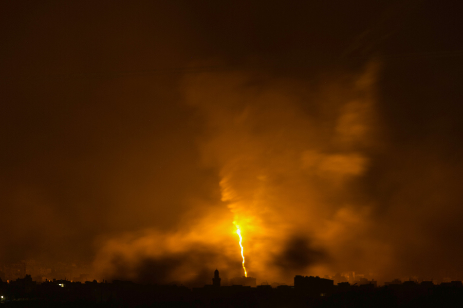 Flares launched by Israeli forces above the Gaza Strip on Saturday amid ongoing fighting in the Israel-Gaza war.