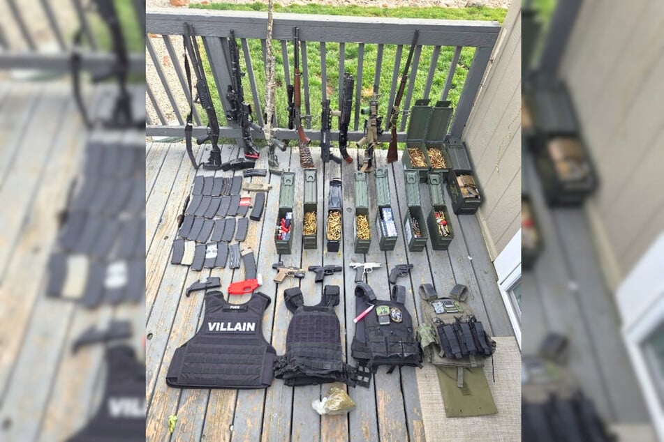 An arsenal of weapons seized at the home of Michael Kamfolt on January 20, 2026 in Anderson, California.