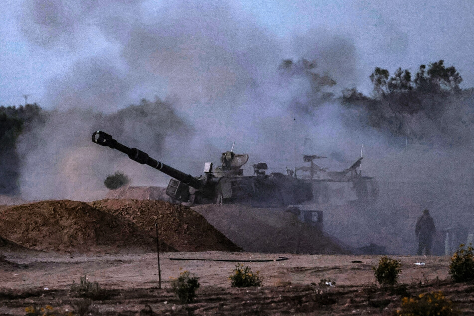 An Israeli mobile artillery unit fires a shell from a border position in southern Israel toward the Gaza Strip on Wednesday amid the ongoing conflict in the Palestinian territory between Israel and the Hamas movement.