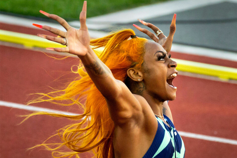 Sha'Carri Richardson celebrates winning the women's 100-meter dash at the Olympic qualifiers in Eugene, Oregon on June 19, 2021.