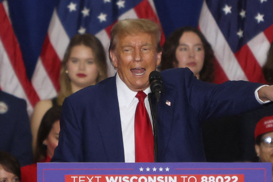 Donald Trump continued his anti-migrant rhetoric during his latest re-election rally in Green Bay, Wisconsin, where he again warned of a "bloodbath" if he loses.