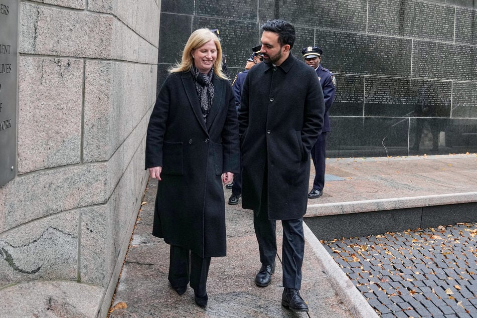 Mayor-elect Zohran Mamdani (r.) and Police Commissioner Jessica Tisch walk together as they visit the New York City Police Memorial on November 19, 2025.