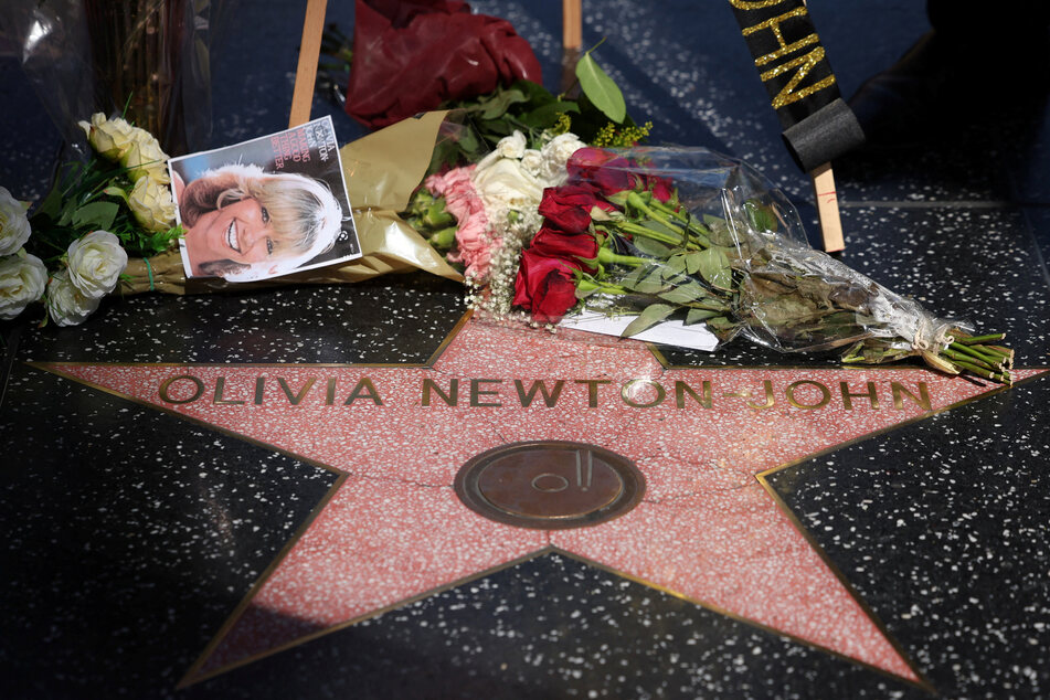 The star of late actor Olivia Newton-John is pictured adorned with flowers and photographs on the Hollywood Walk of Fame in Los Angeles.