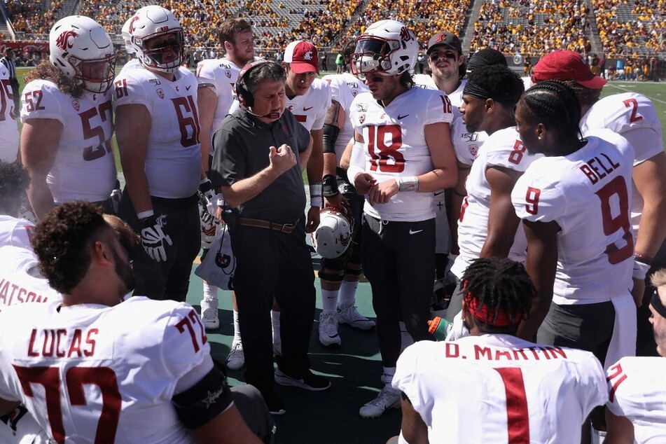 Mississippi State football head coach Mike Leach (c.) remains in critical condition after suffering a "personal health issue" on Sunday, the school announced.