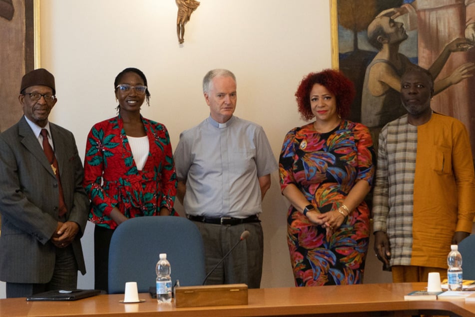 From l. to r.: Dr. Ron Daniels, Dr. Amara Enyia, Bishop Paul Tighe, Nikole Hannah-Jones, and Kamm Howard meet at the Vatican to discuss the Catholic Church's role in the Transatlantic Slave Trade.