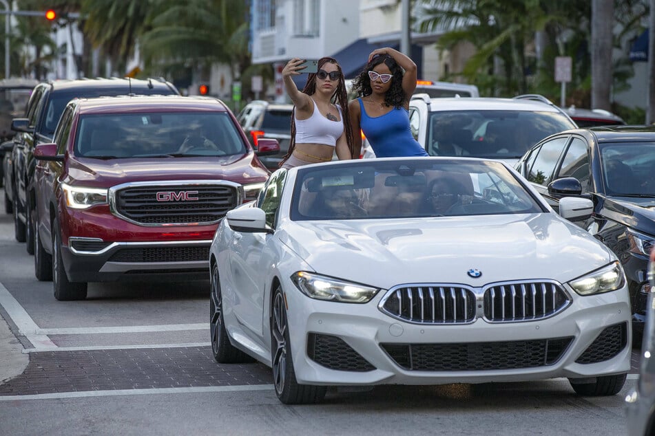 Spring breakers have been pouring on to party hotspots like Miami's South Beach.