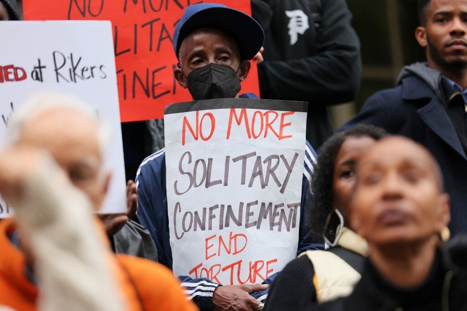 Demonstrators rally at New York City Hall to protest a string of deaths on Rikers Island and all for an end to the use of solitary confinement and other forms of torture.