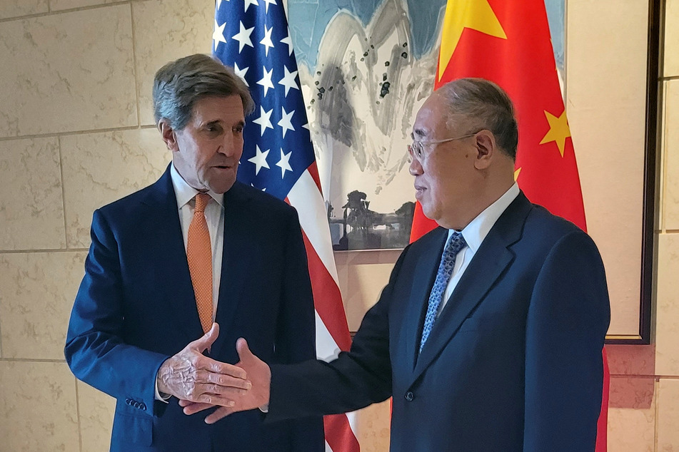 US Special Presidential Envoy for Climate John Kerry shakes hands with his Chinese counterpart Xie Zhenhua before a meeting in Beijing, China, on July 17, 2023.