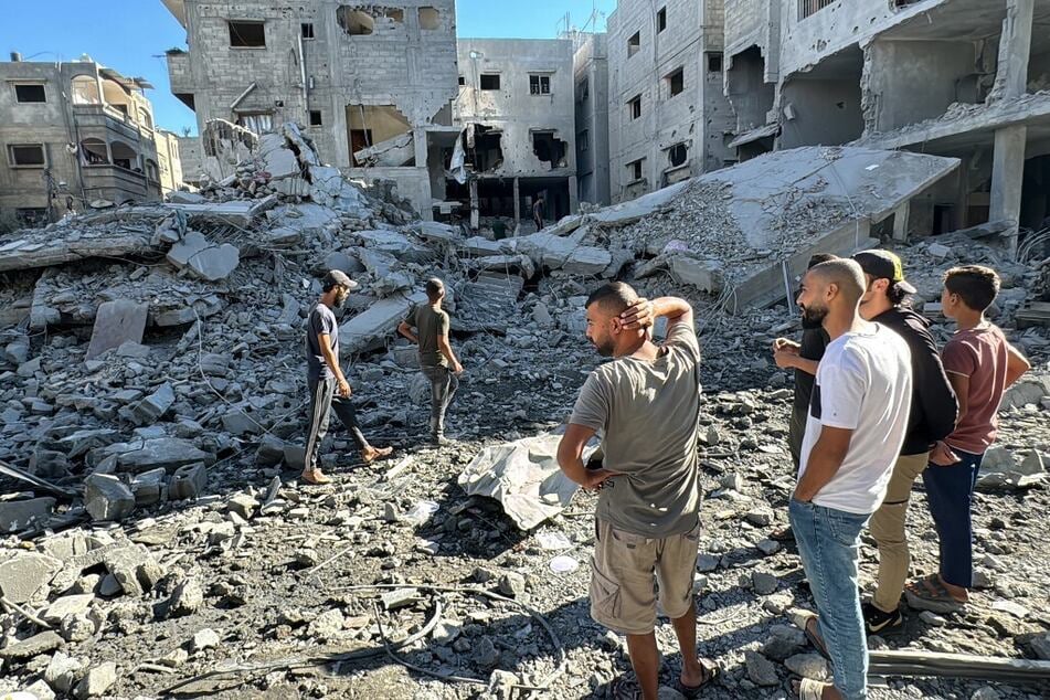 Palestinians inspect the damage after an Israeli airstrike the previous night in Beit Lahia, in the northern Gaza Strip, on October 20, 2024.