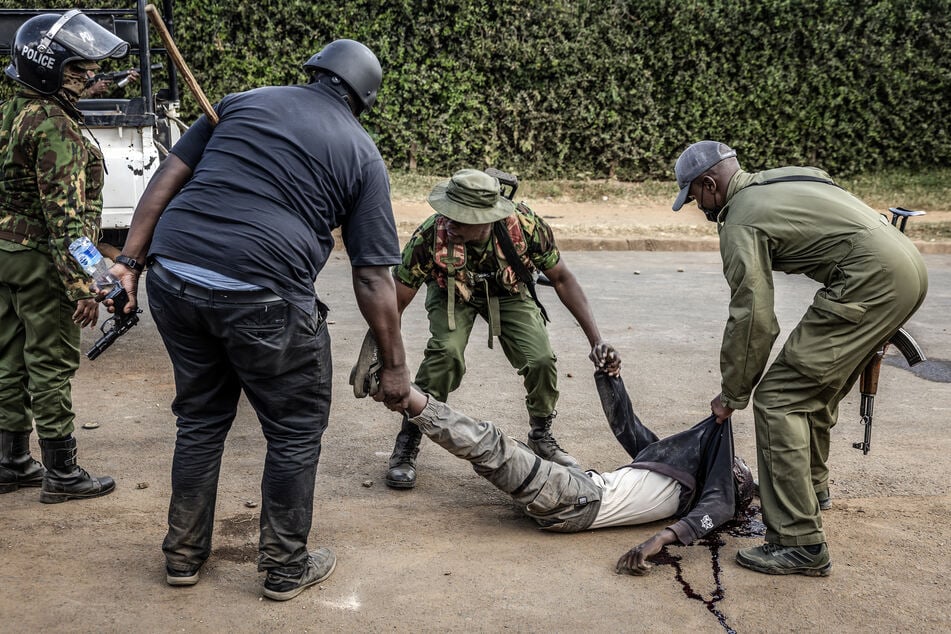 At least one person shot as Kenyan protests at US Ebola center take violent turn