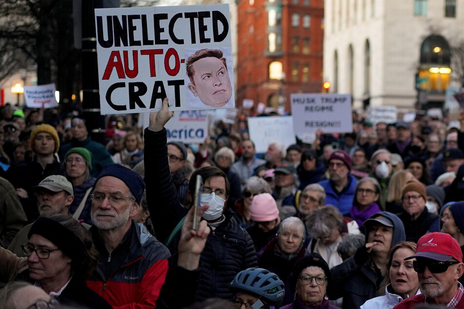 Demonstrators rally outside the US Treasury Department after it was reported billionaire Elon Musk has gained access to Treasury's federal payments system.