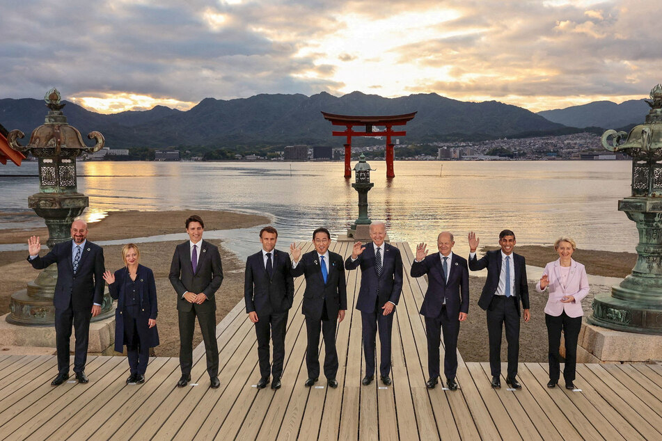 World leaders attend a family photo session at Itsukushima Shrine during the G7 leaders' summit in Hiroshima, Japan.