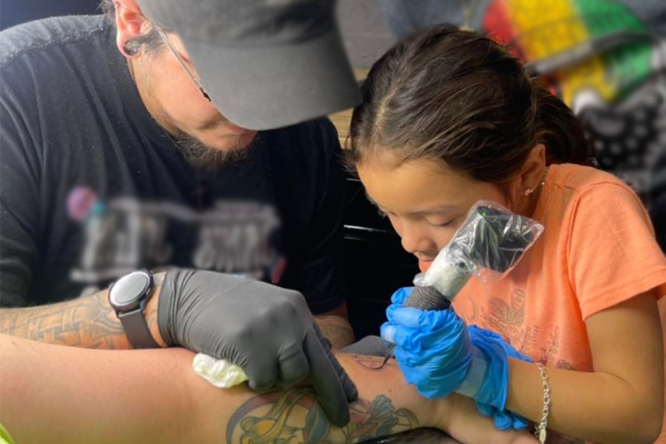 Eight-year-old tattoos like a pro and wows clientele with impressive ink