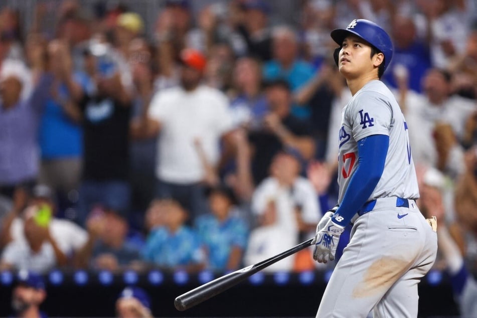 Shohei Ohtani of the Los Angeles Dodgers hits a two-run home run, his 50th of the season, becoming the first player with a 50/50 season in MLB history, against the Miami Marlins on September 19, 2024.