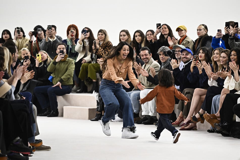 German designer Chemena Kamali acknowledges the audience after presenting creations by Chloe for the Women Ready-to-wear Fall-Winter 2024/2025 collection as part of the Paris Fashion Week in Paris on Friday.