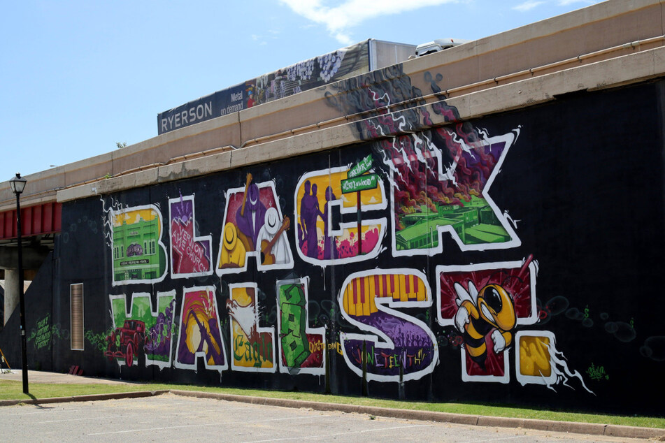 A Black Wall Street mural on the north side of the I-244 highway that runs through the historic Greenwood District in North Tulsa.